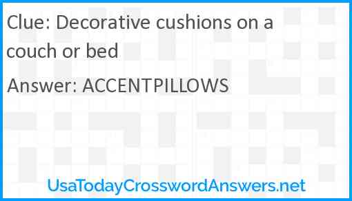 Decorative cushions on a couch or bed Answer