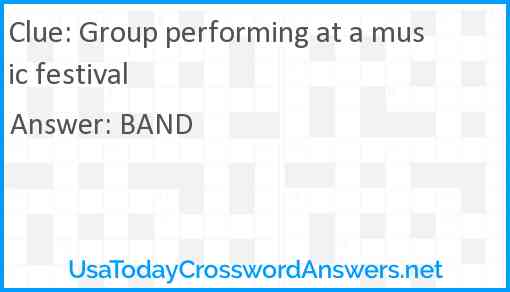 Group performing at a music festival Answer